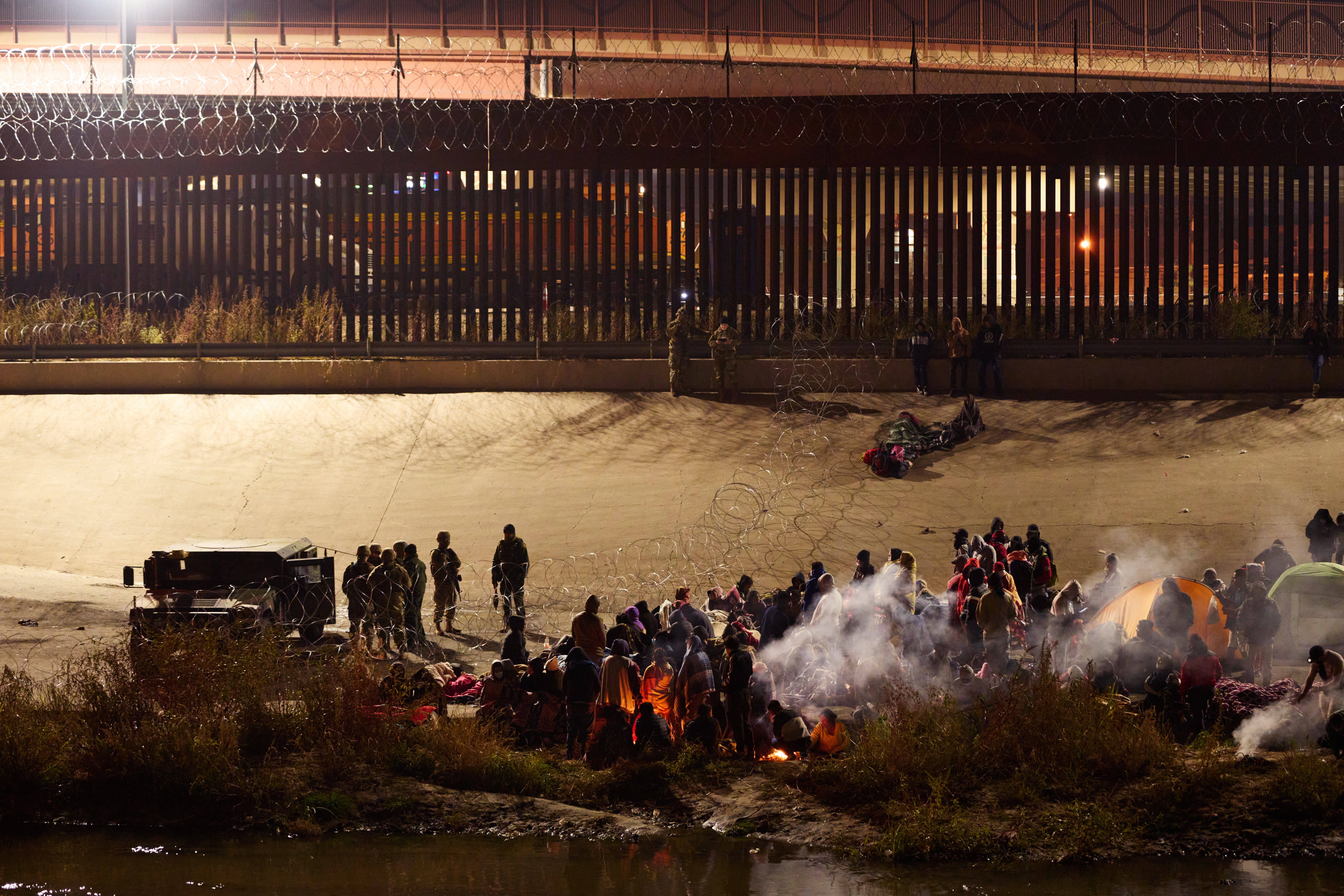 Migrants cross U.S.-Mexico border
