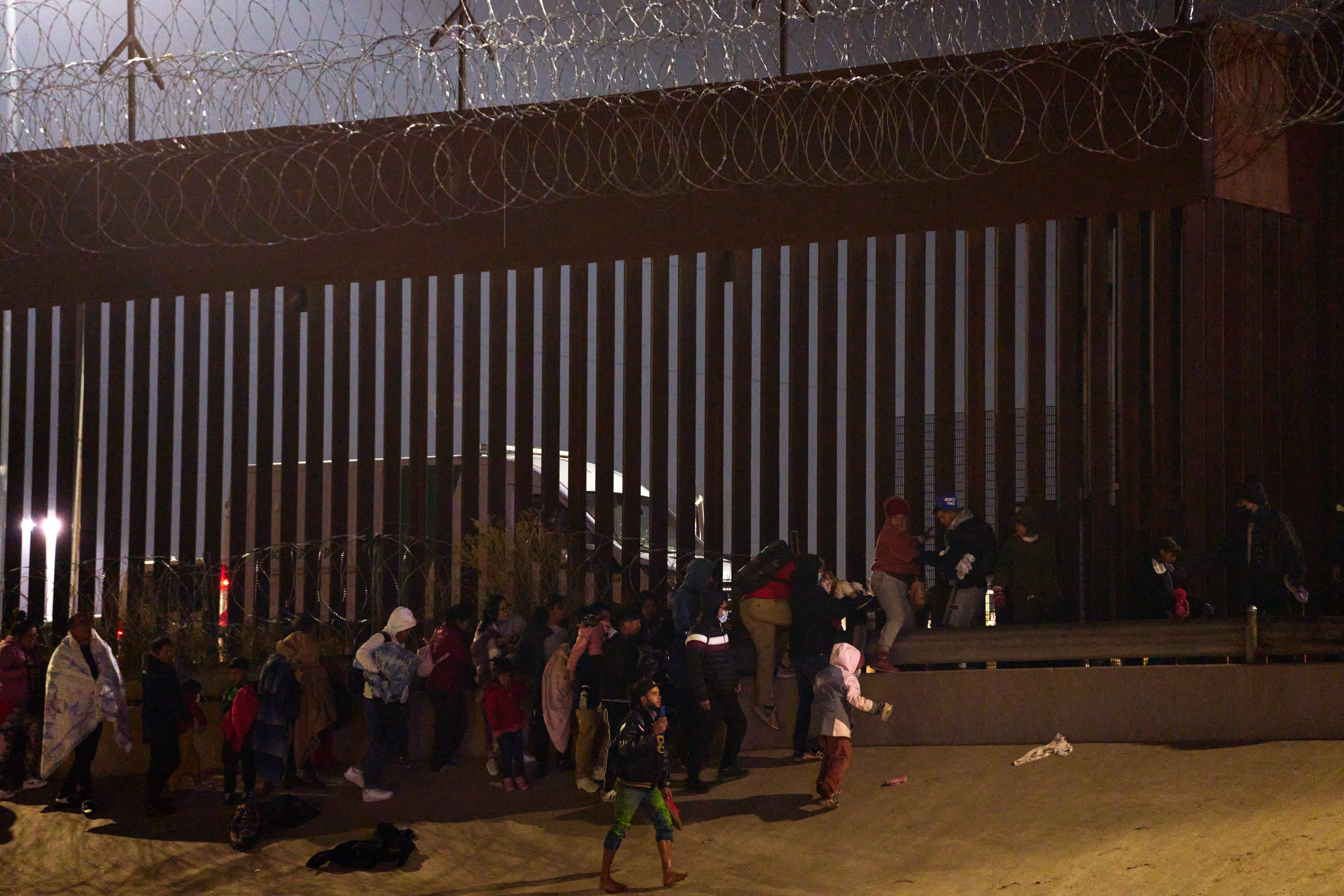 Migrants cross U.S.-Mexico border